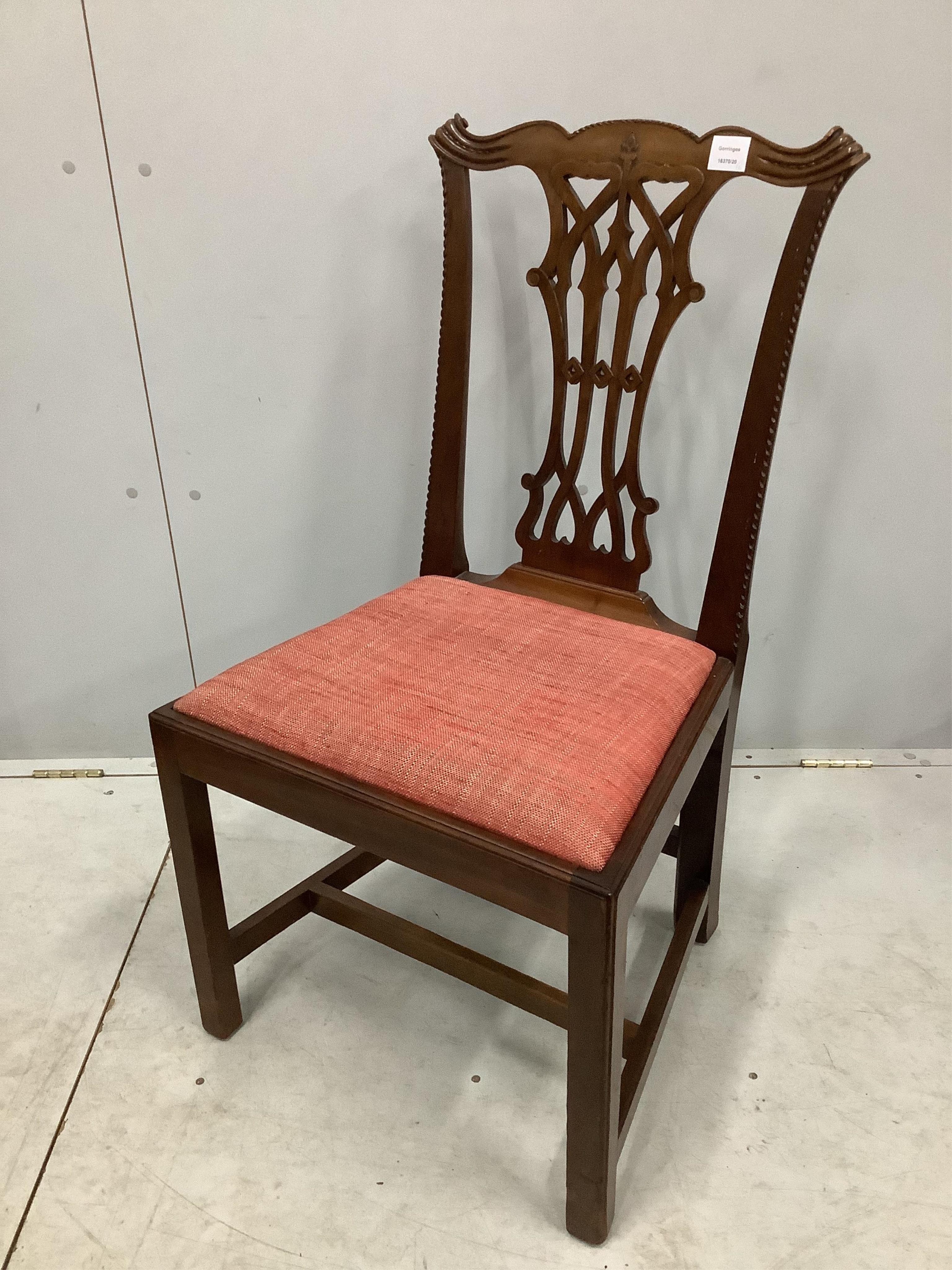 A set of six George III style mahogany Chippendale design dining chairs, with pierced splats, over drop-in seats and H stretchers. Condition - fair to good